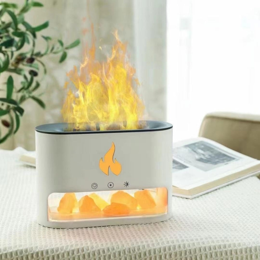 Real flame effect aroma diffuser with cool mist humidifier glowing at night.