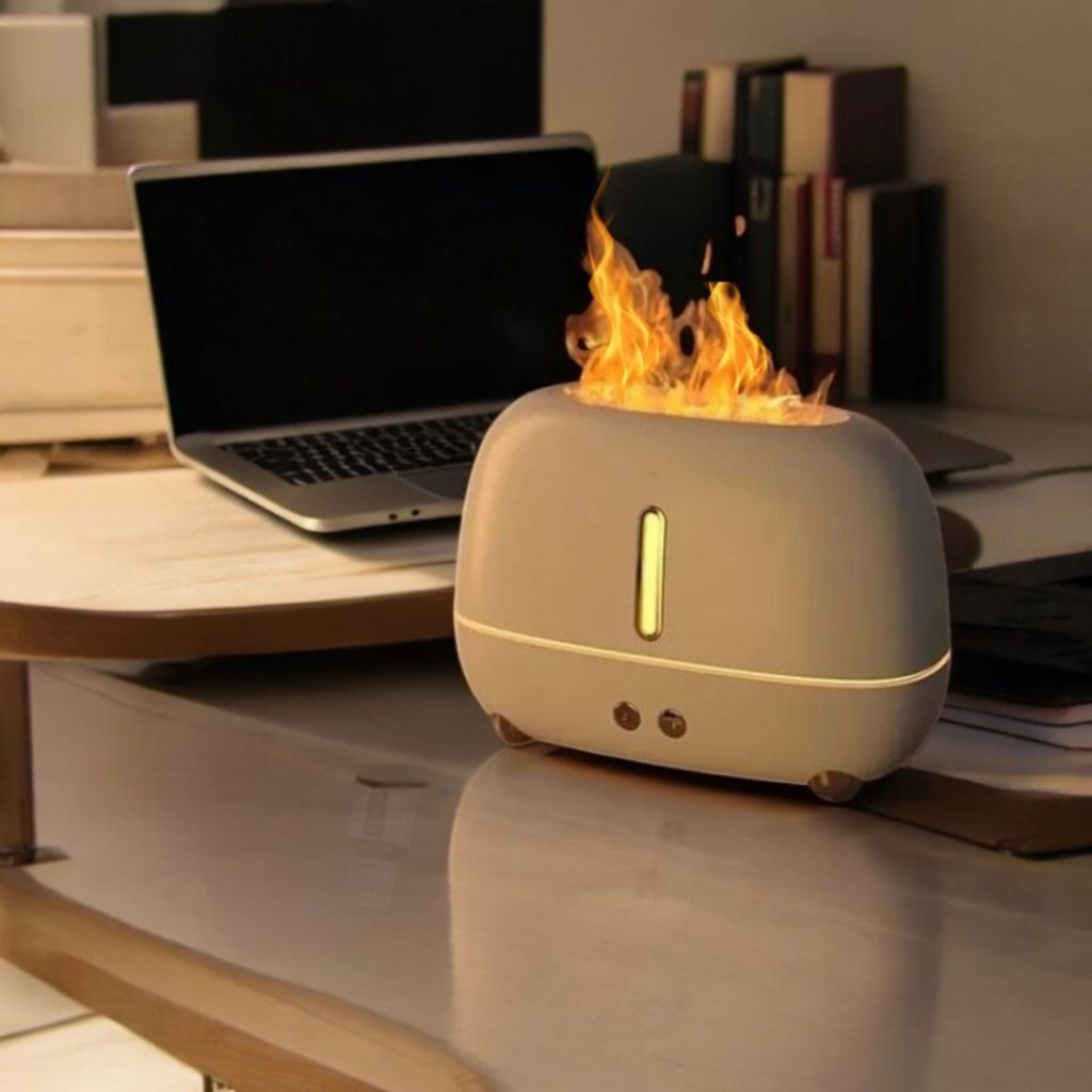 Modern flame effect aroma diffuser with cool mist humidifier glowing in room.